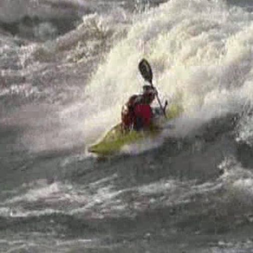 An adventurous kayaker defies the big waves An adventurous kayaker defies the big waves