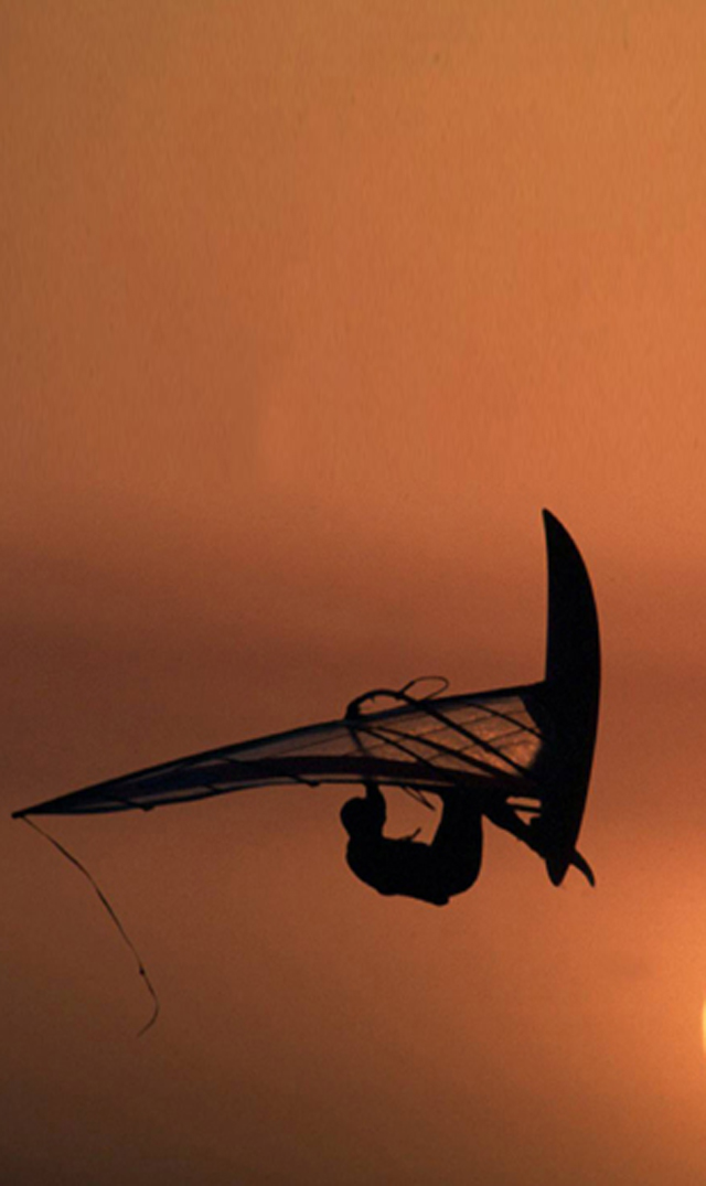 An amazing jump of a skateboarder at sunset!