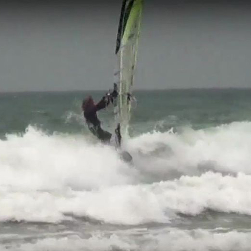 Jules Denzel caressing waves on his sailboard!